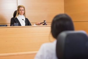 lawyer listening tothe judge in the court room